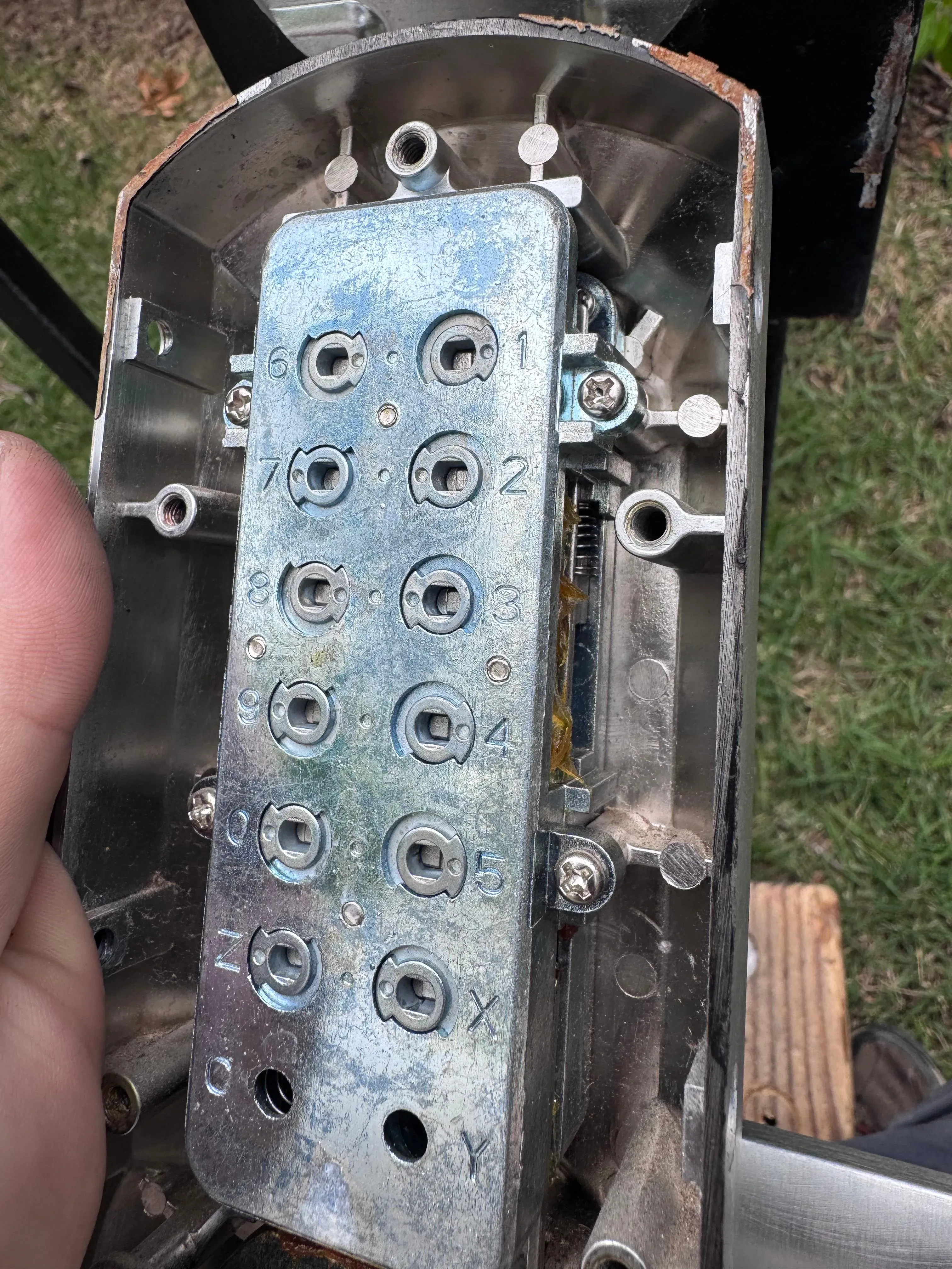 Technician repairing a commercial keypad access control mechanism in Texas