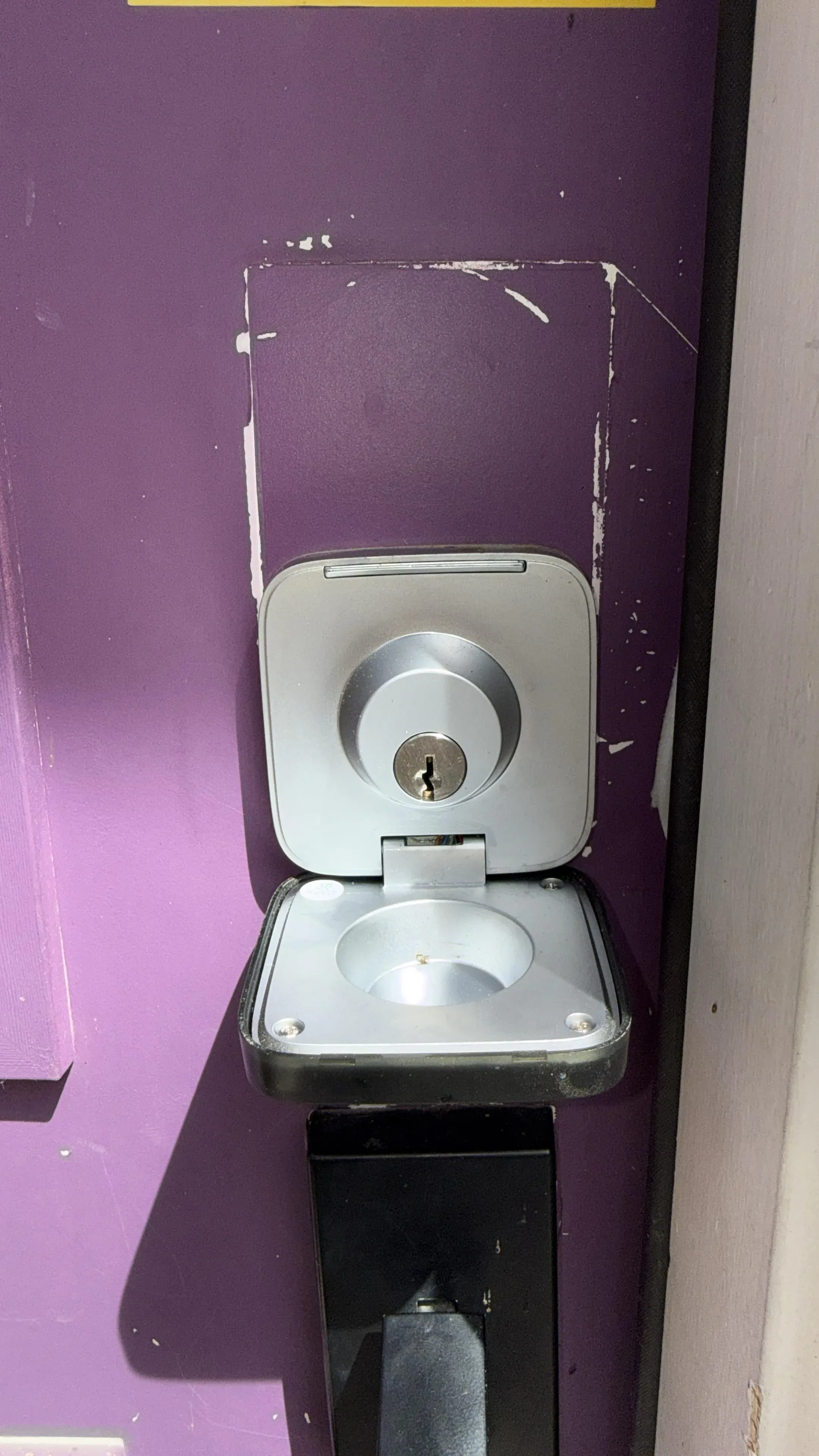 A Level smart deadbolt with the interior bolt visible, the kind of smart lock hardware that integrates with platforms like Abode