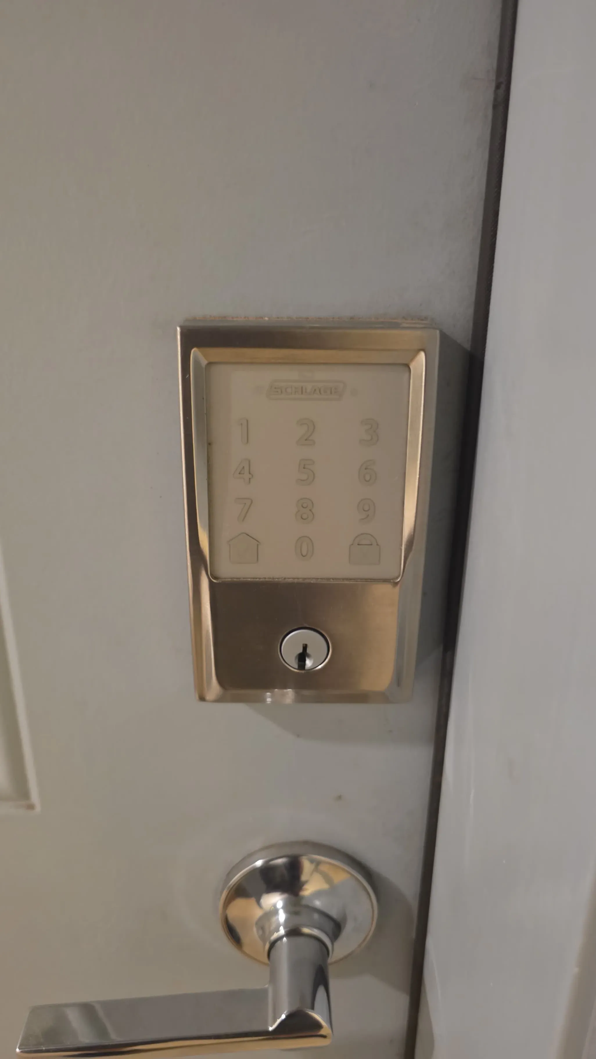 A smart lock with keypad entry installed on a residential door, similar to the smart lock options popular with Texas renters