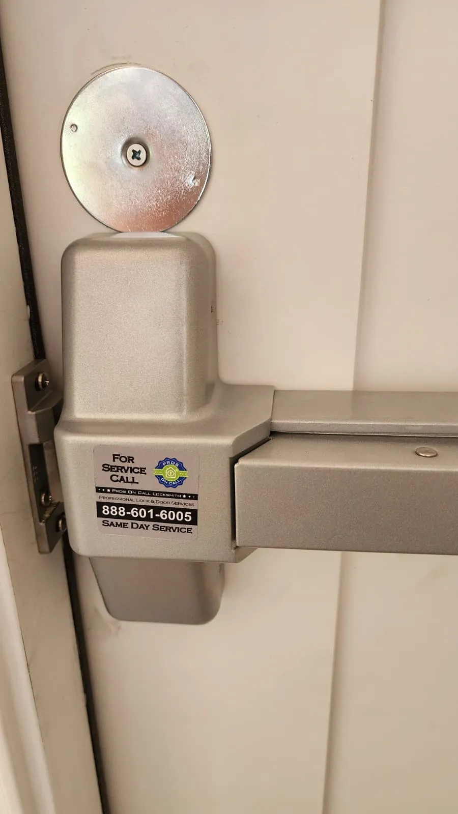 Close-up of panic bar hardware installed by Pros On Call Austin commercial locksmith