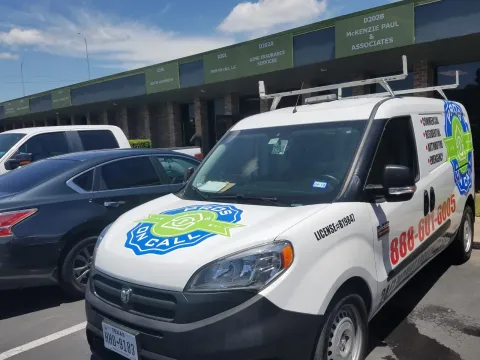 Pros On Call Ram ProMaster service van parked outside an Austin TX office building ready to respond