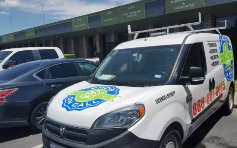 Pros On Call Ram ProMaster service van parked outside an Austin TX office building ready to respond