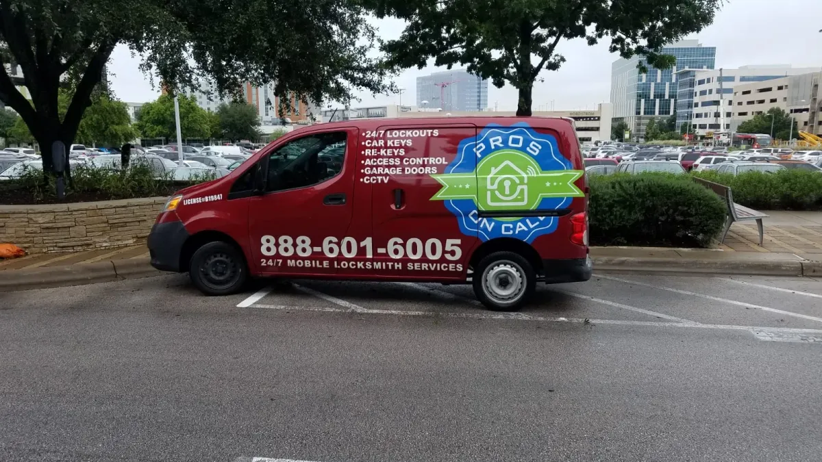 Pros On Call red Nissan NV200 service van parked at an Austin TX medical complex for a 24-hour emergency locksmith call