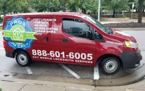 Side panel of a Pros On Call red Nissan NV200 service van listing locksmith services in Austin TX
