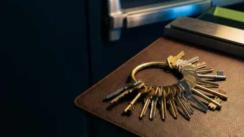 Pros On Call commercial locksmith demonstrating master key hardware alongside a panic bar at an Austin TX business