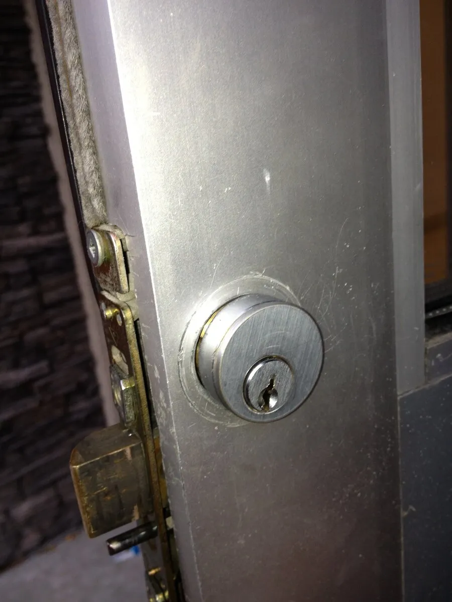 A commercial mortise lock cylinder installed in a business door, Dallas, Texas