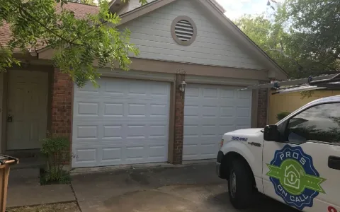Residential garage door in excellent condition at an Austin TX home, representing a well-maintained door near its expected lifespan