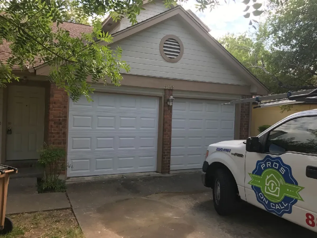 Well-maintained white two-car garage door at an Austin TX home, a result of regular Pros On Call maintenance service