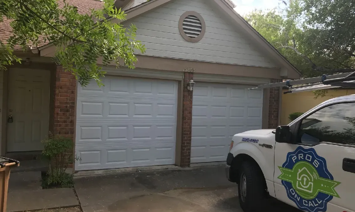 Well-maintained white two-car garage door at an Austin TX home, a result of regular Pros On Call maintenance service