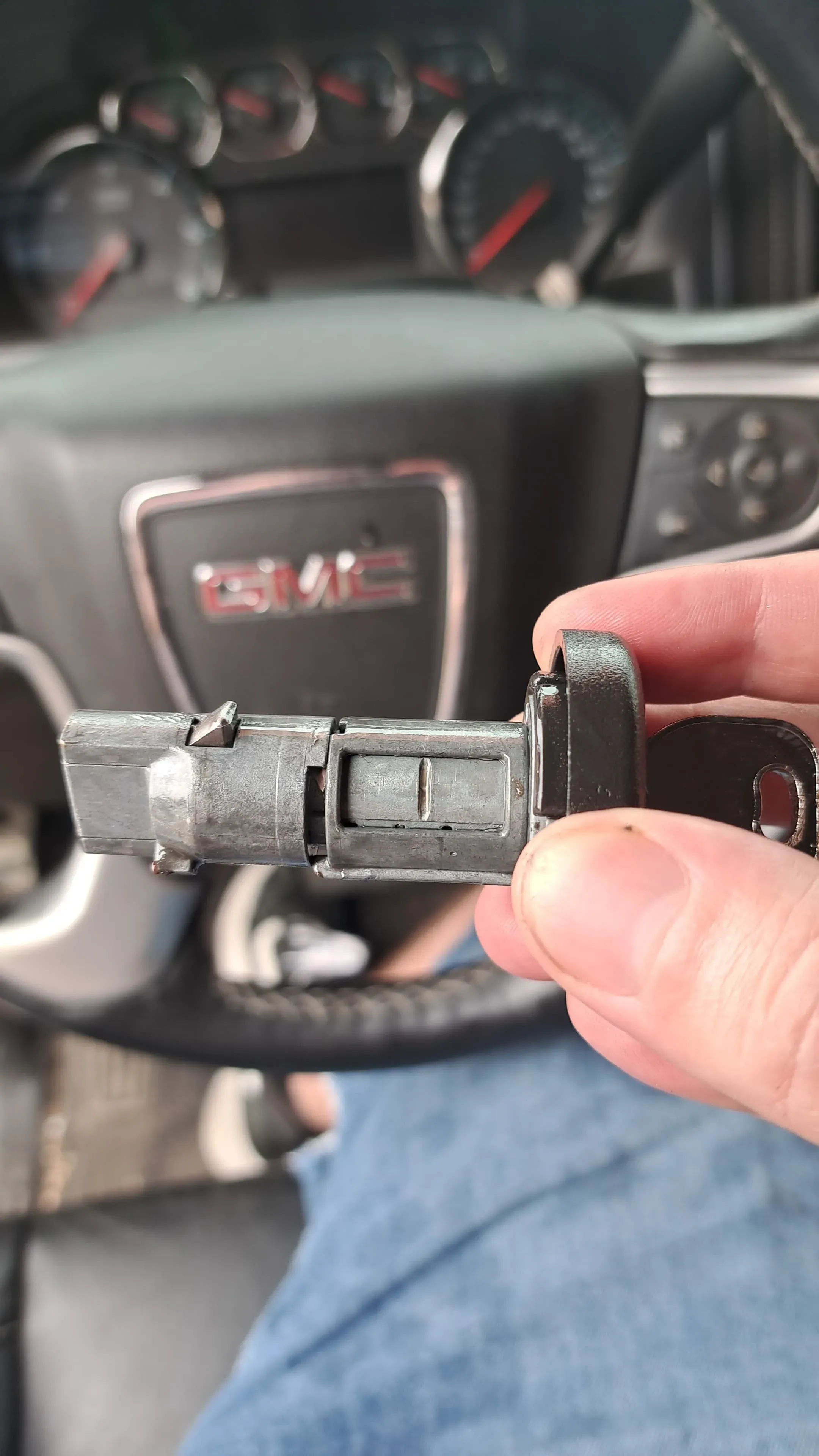 Pros On Call locksmith servicing a GMC ignition cylinder, part of the immobilizer system tied to key fob programming