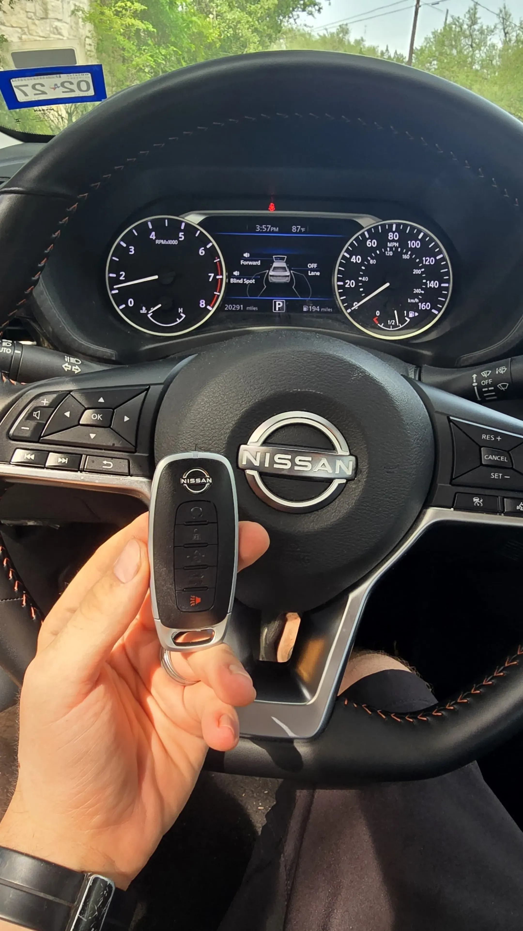 Pros On Call locksmith handling a Nissan smart key fob during a replacement service in Texas