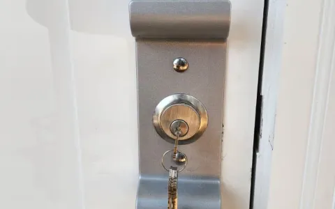 Pros On Call service sticker applied after barrel lock and key service at an Austin TX property, showing a verified and trusted locksmith completed the job