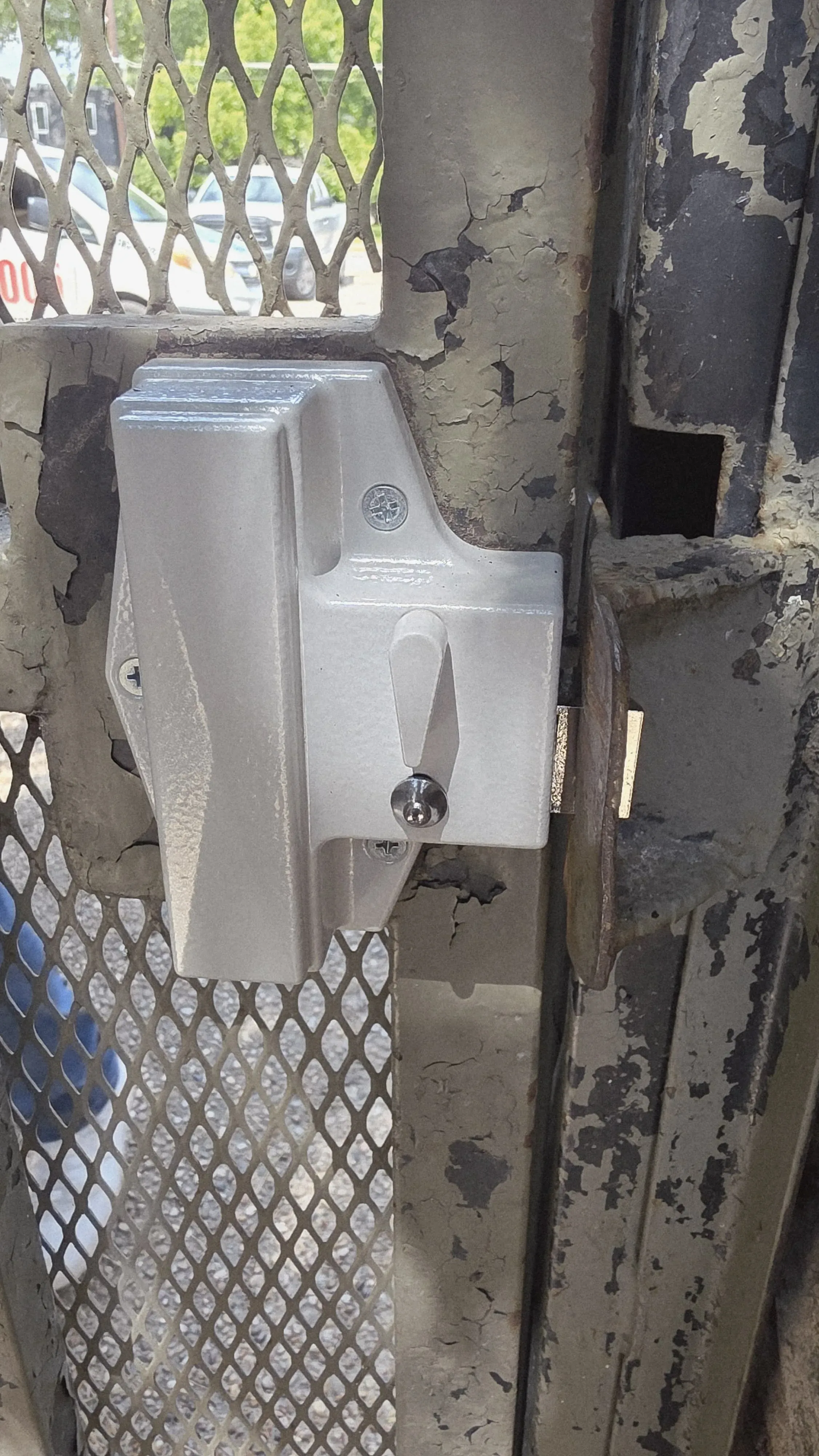 Commercial gate latch and chain link hardware on a Texas property