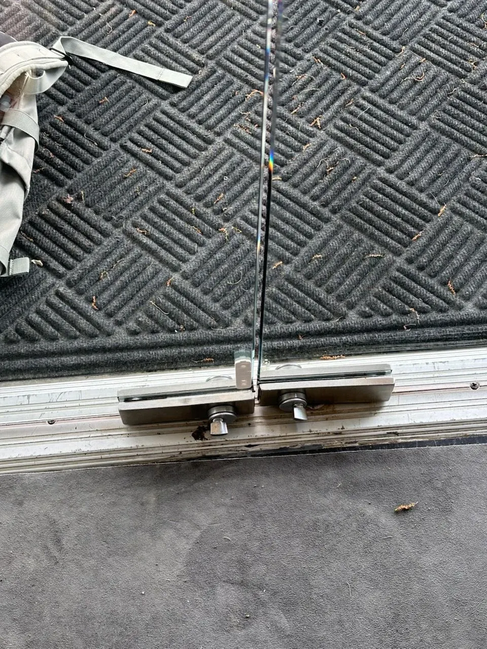 Commercial glass door with pivot closer hardware in Texas, relevant to fire code egress