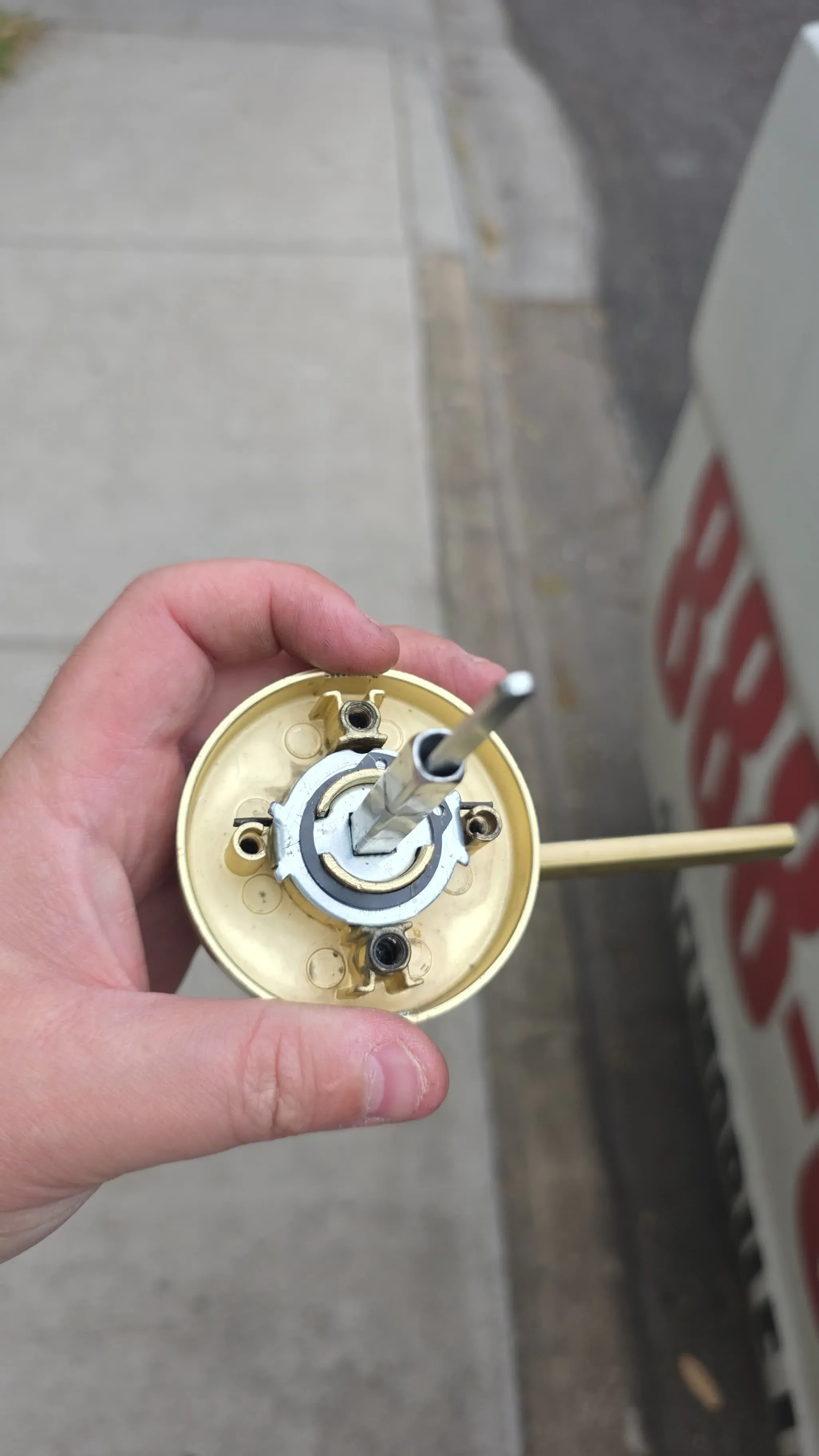 Disassembled brass lever and rose hardware from a residential door lock upgrade in Austin