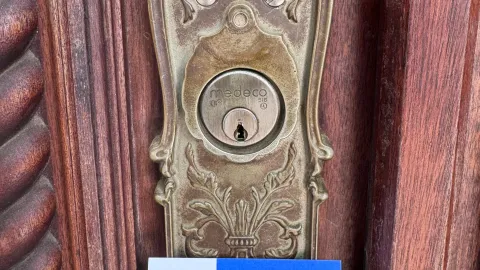 Close-up of an ornate brass residential deadbolt in Austin TX, representing high-grade ANSI lock quality for home security
