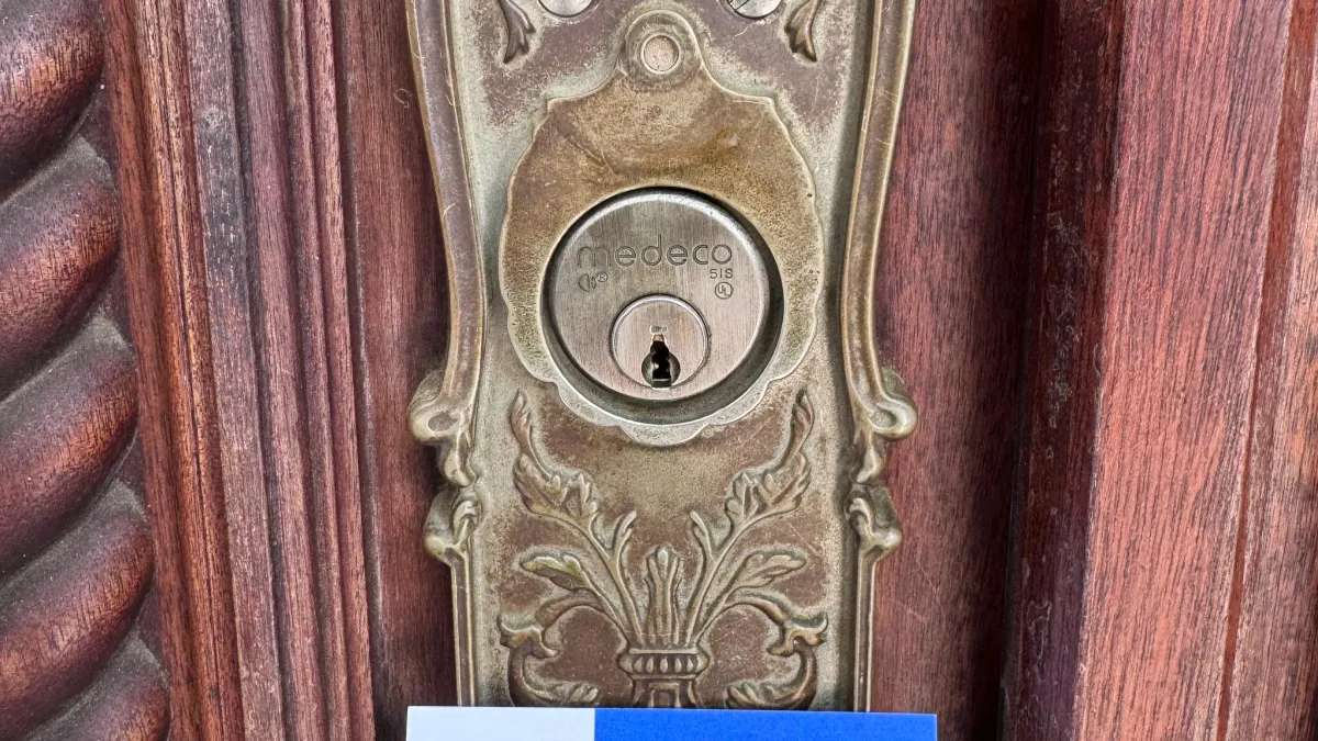 Close-up of an ornate brass residential deadbolt in Austin TX, representing high-grade ANSI lock quality for home security