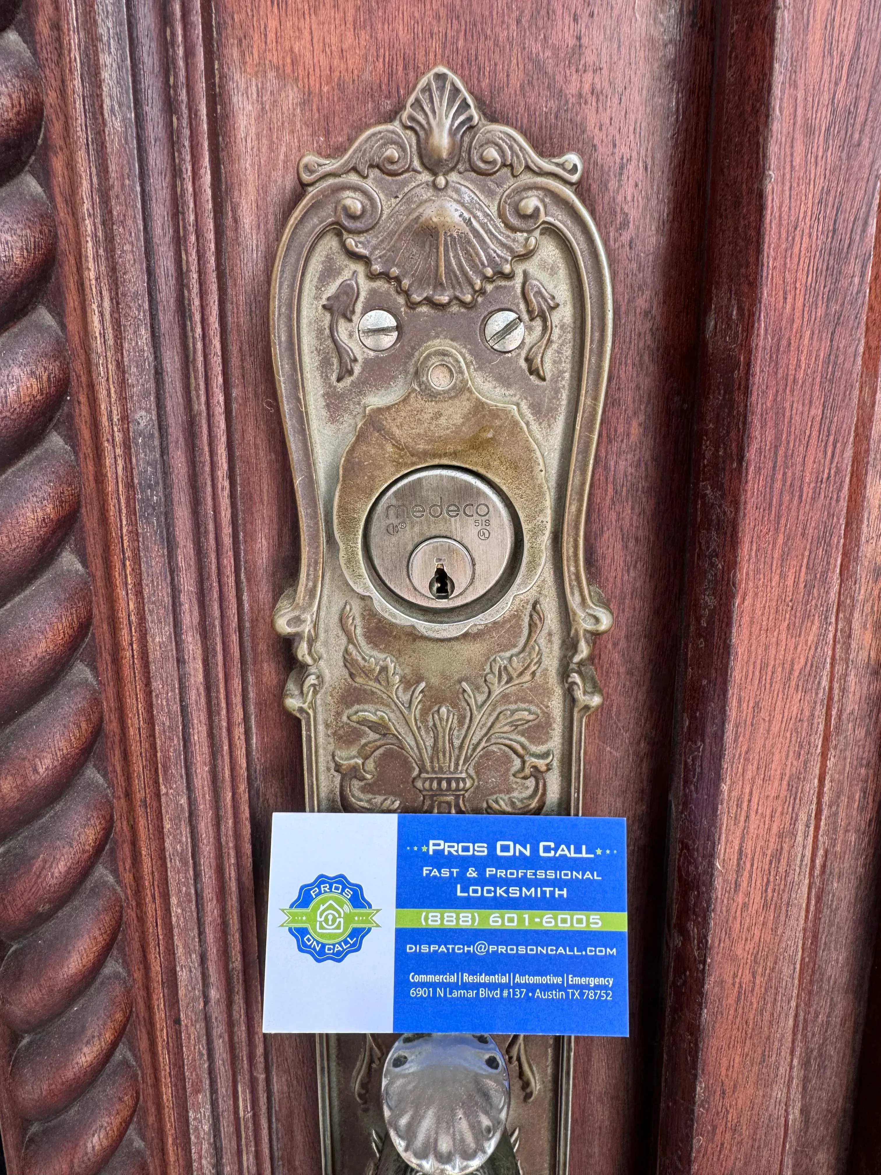 Close-up of ornate brass deadbolt installed on Austin residential door by Pros On Call