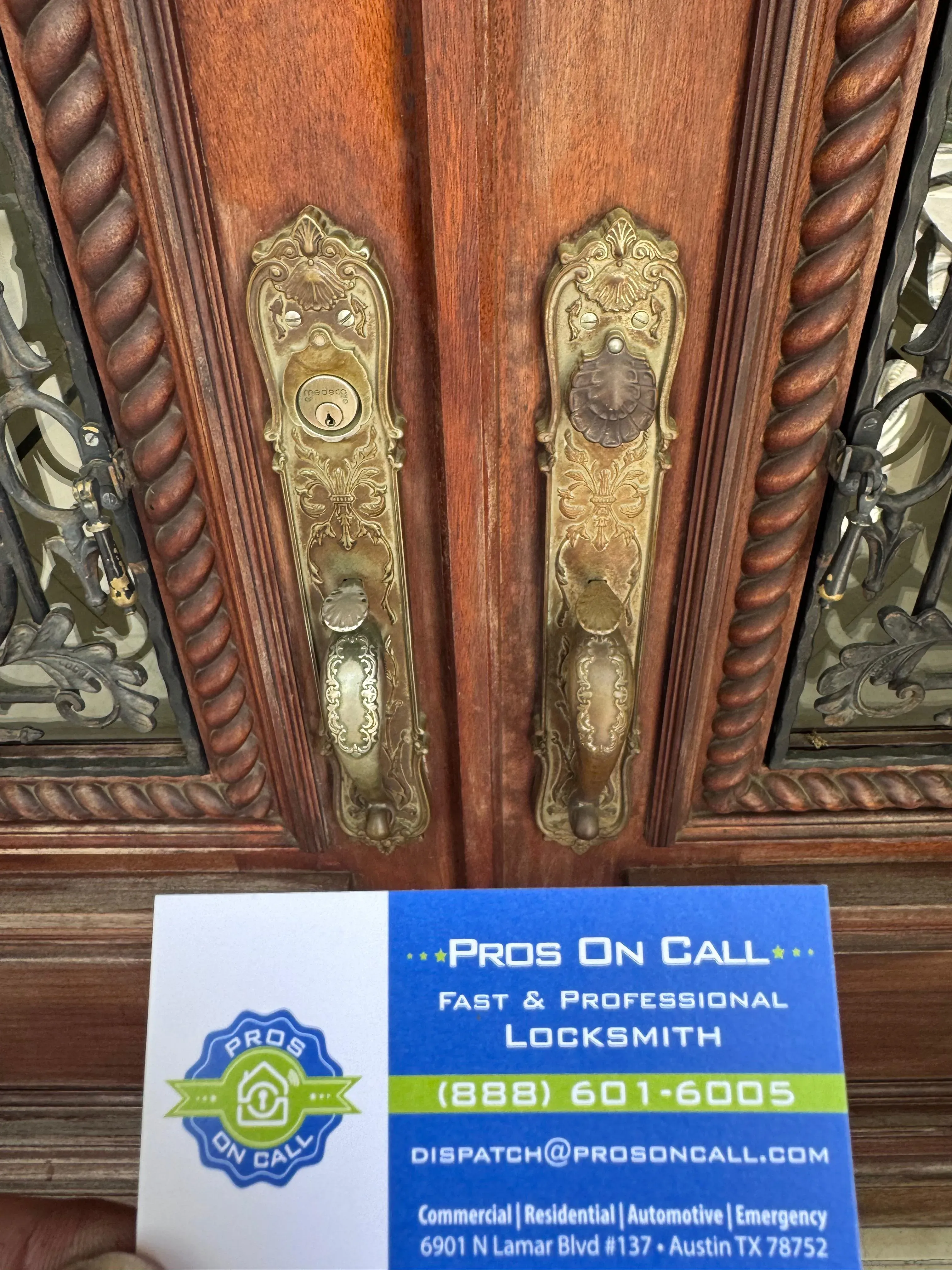 Ornate brass deadbolts on a double-door residential property in Austin, Texas