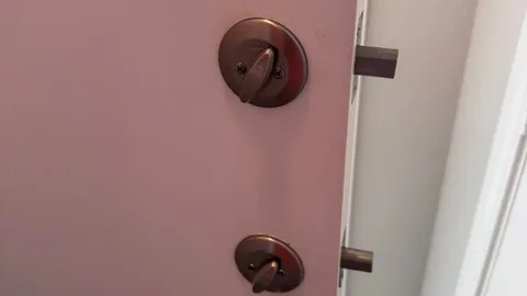Pros On Call residential locksmith at an Austin TX home doorway assisting a homeowner who was locked out