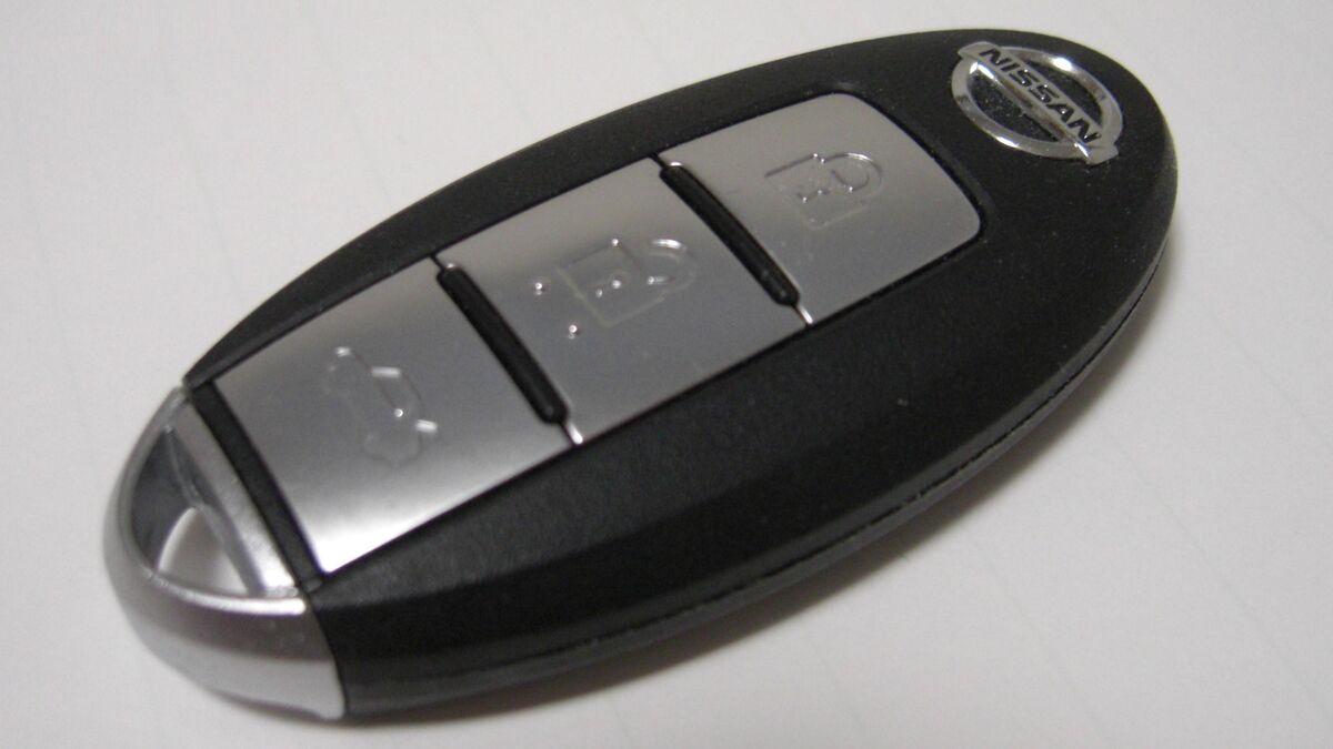 Transponder car key with visible electronic chip on a workbench