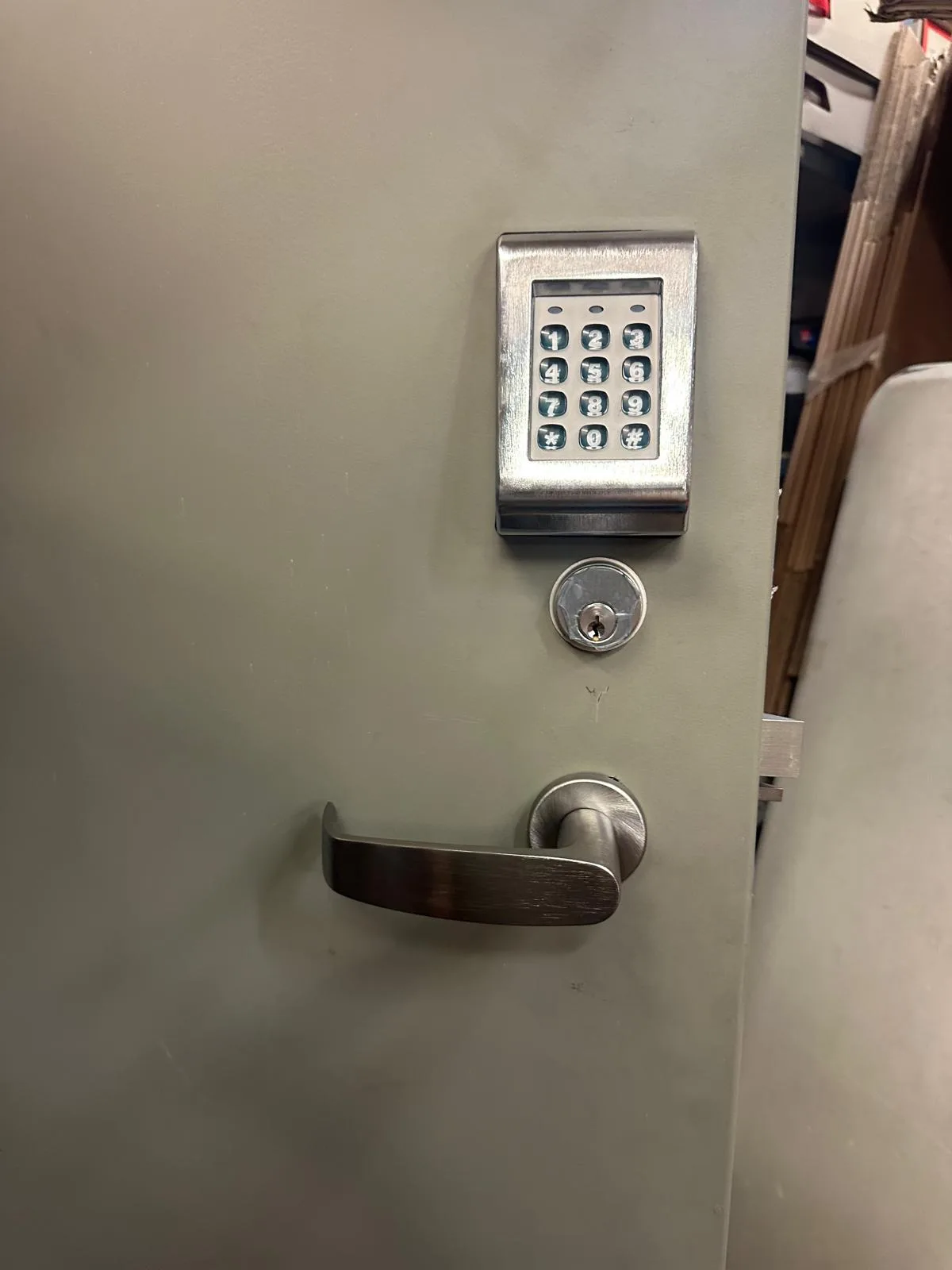 Alarm Lock commercial keypad installed on metal door at Austin business by Pros On Call