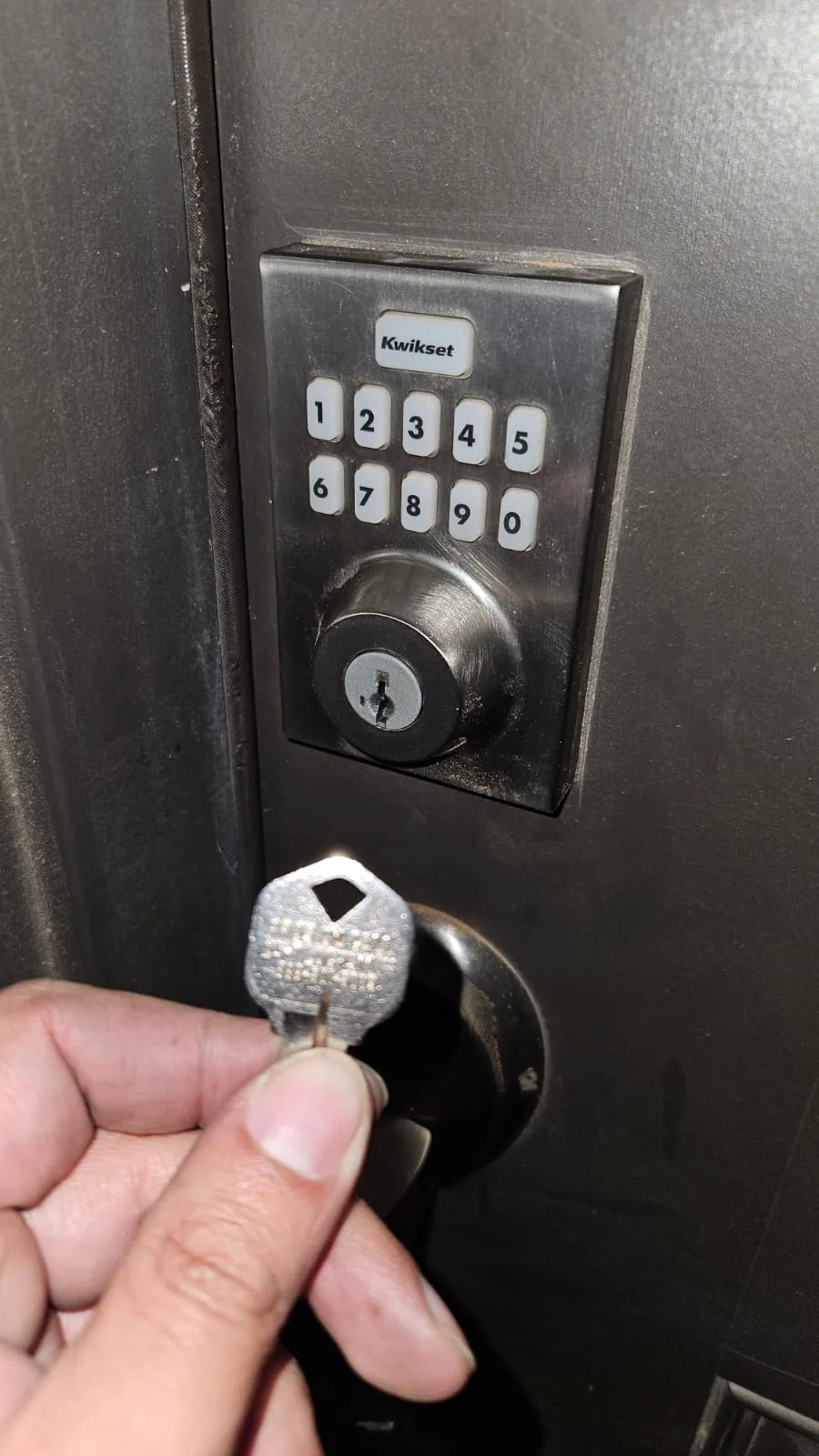 Kwikset smart keypad deadbolt with key insert installed by Pros On Call - keypad and traditional key combination