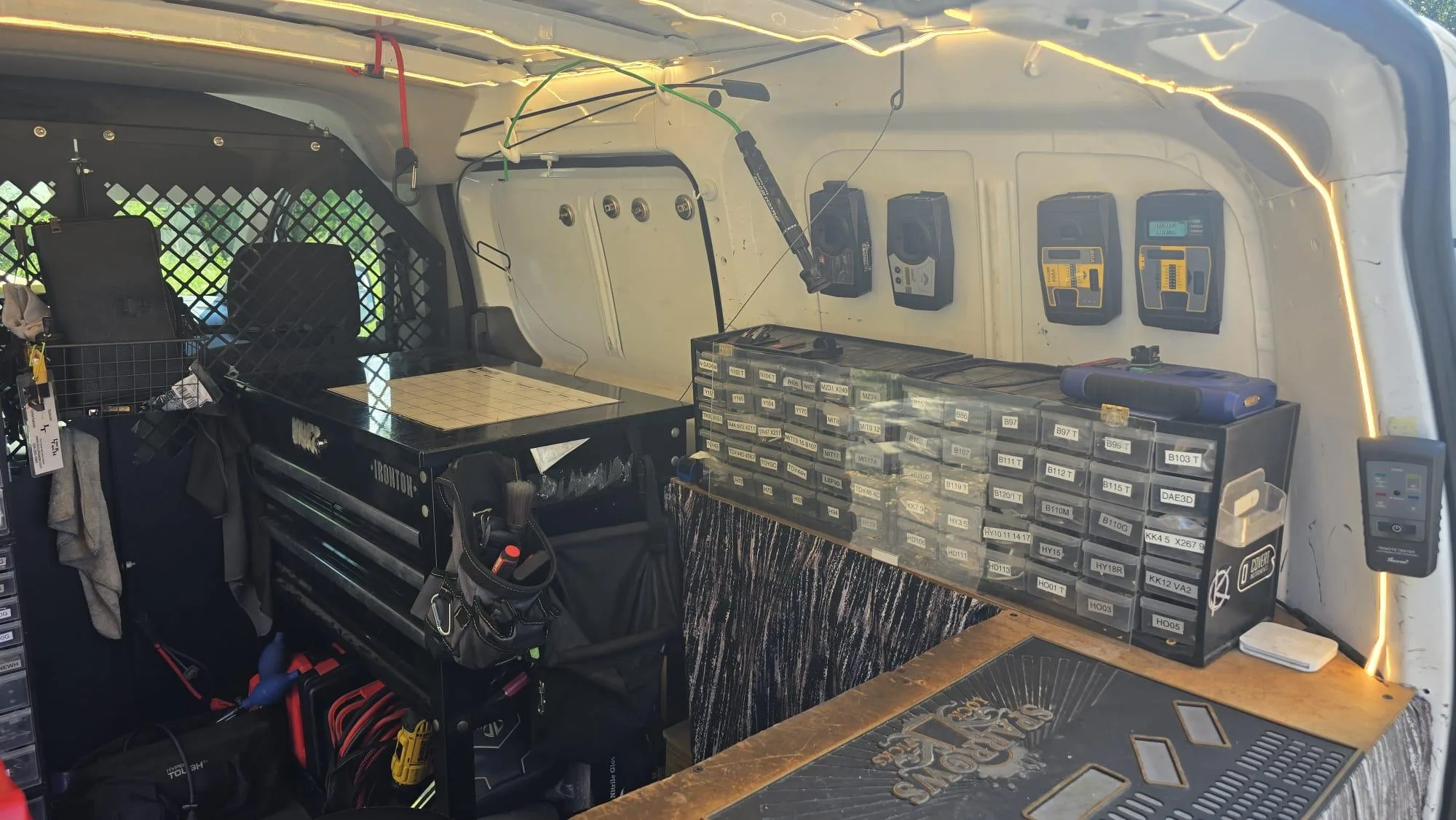 Pros On Call van interior with LED lighting and key blanks showing professional mobile locksmith setup