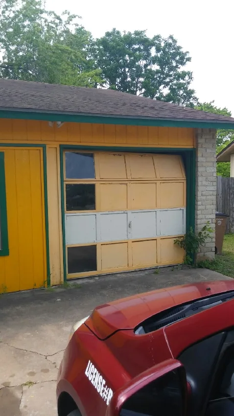 Before photo: dilapidated yellow garage door at Austin home, candidate for replacement by Pros On Call