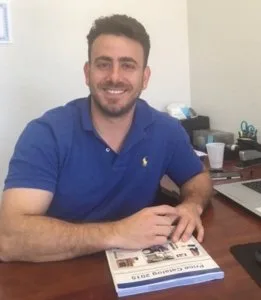 Dean Lavi, CEO and founder of Pros On Call, at his Austin office desk
