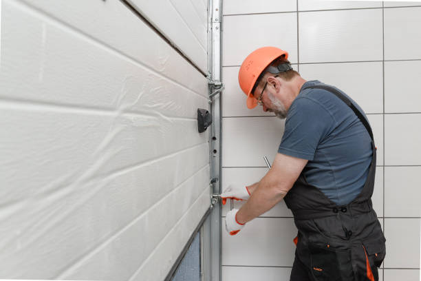 The worker is installing the lifting gates of the garage. For best services for Door Repair and Installation Corpus Christi TX choose Pros on Call