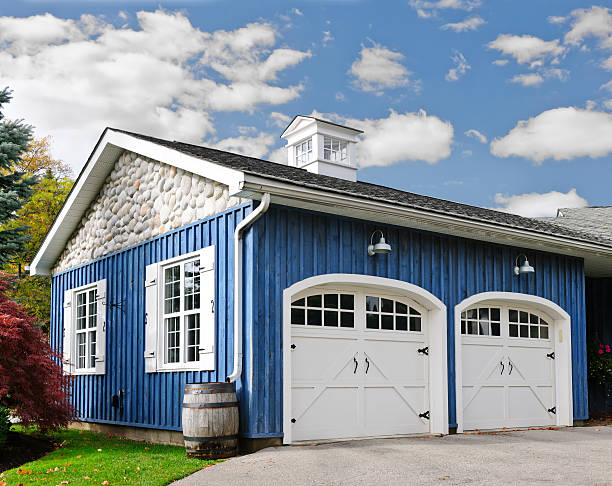 Double car garage with white doors & blue exterior