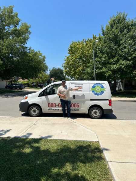 Our Personnel for Emergency Locksmiths in Seguin TX is wearing white blouse. In his back is Pros on Call Vehicle ready for any emergency Locksmith Service in Bastrop TX