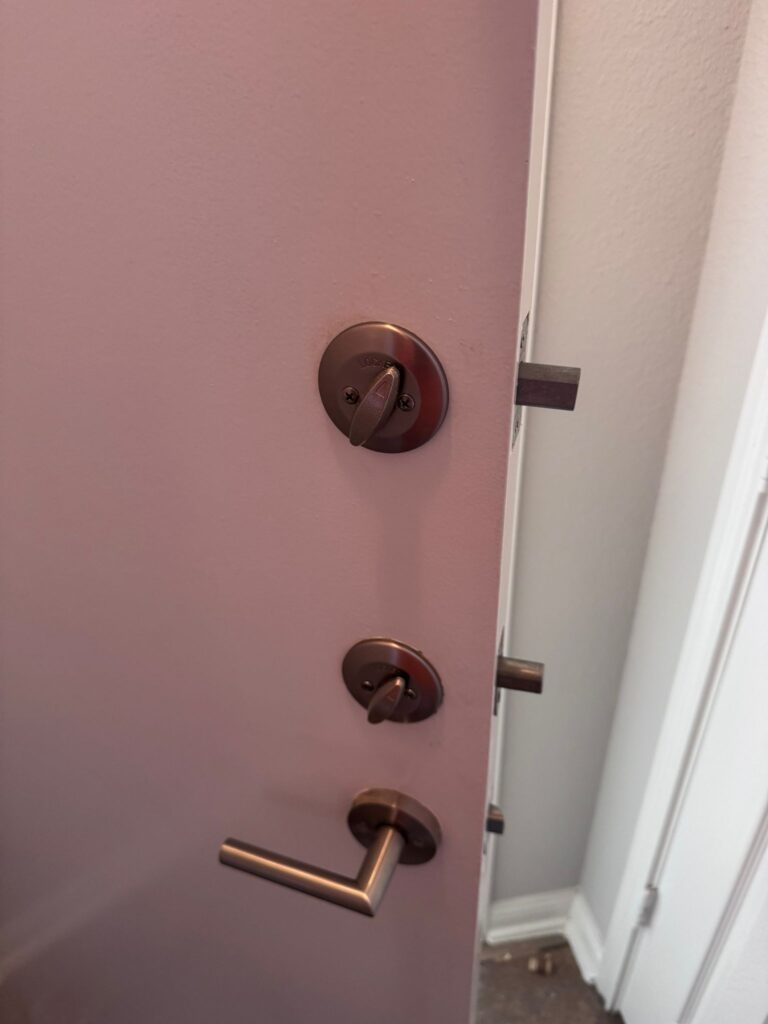 Residential Pink Door Has been fixed by Pros On Call - Residential Locksmith in Hutto TX